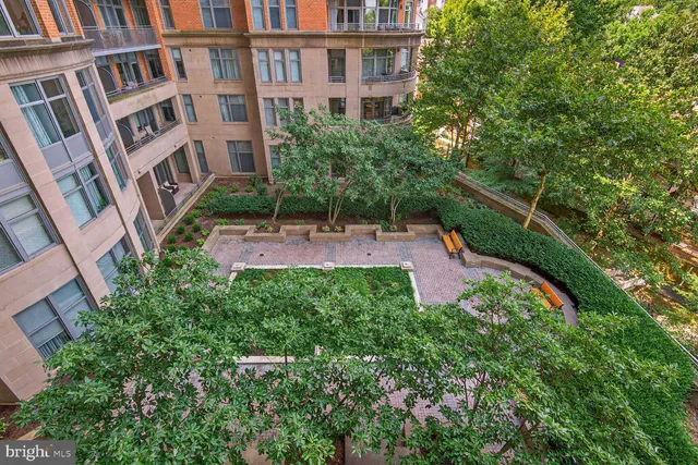 an aerial view of multiple houses with yard