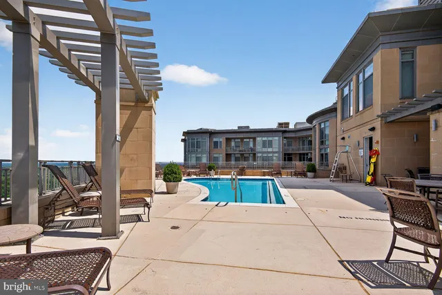 a view of a patio with couches chairs and potted plants