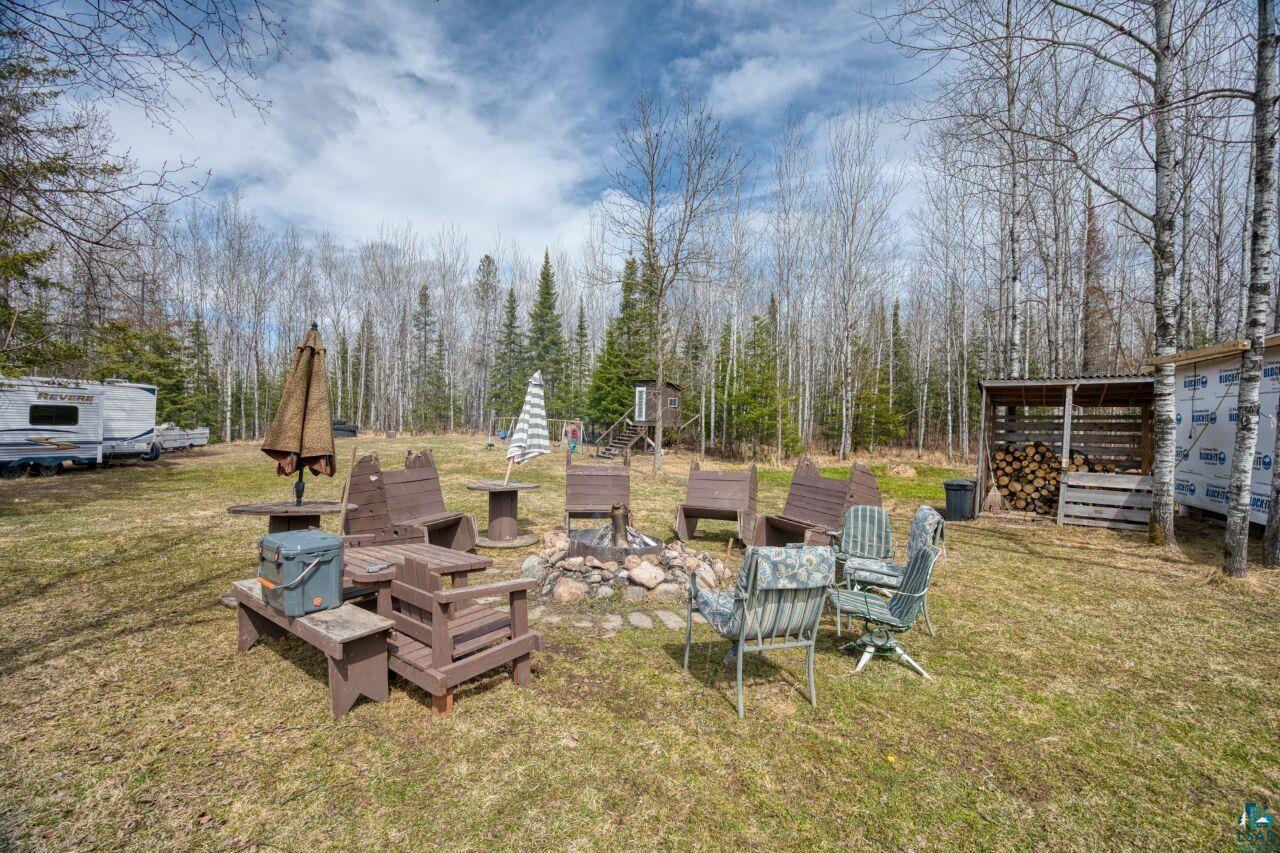 5303 Markham Road Makinen, MN 55763 - Photo 20 of 36 View of yard featuring an outdoor fire pit