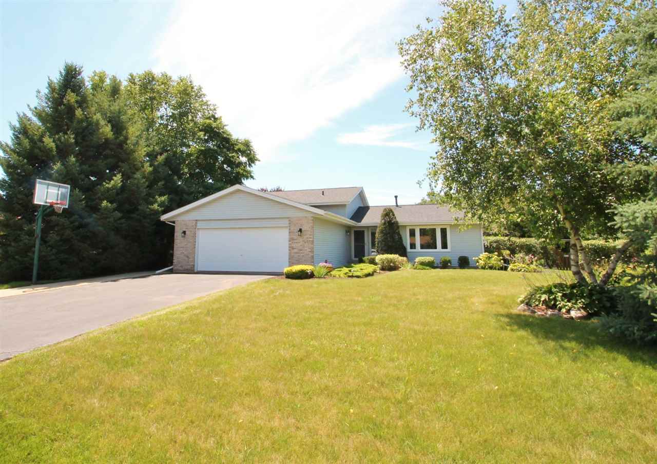 518 Pin Oak Road Rockton, IL 61072 - Photo 1 of 25 a yellow house with a yard in front of it
