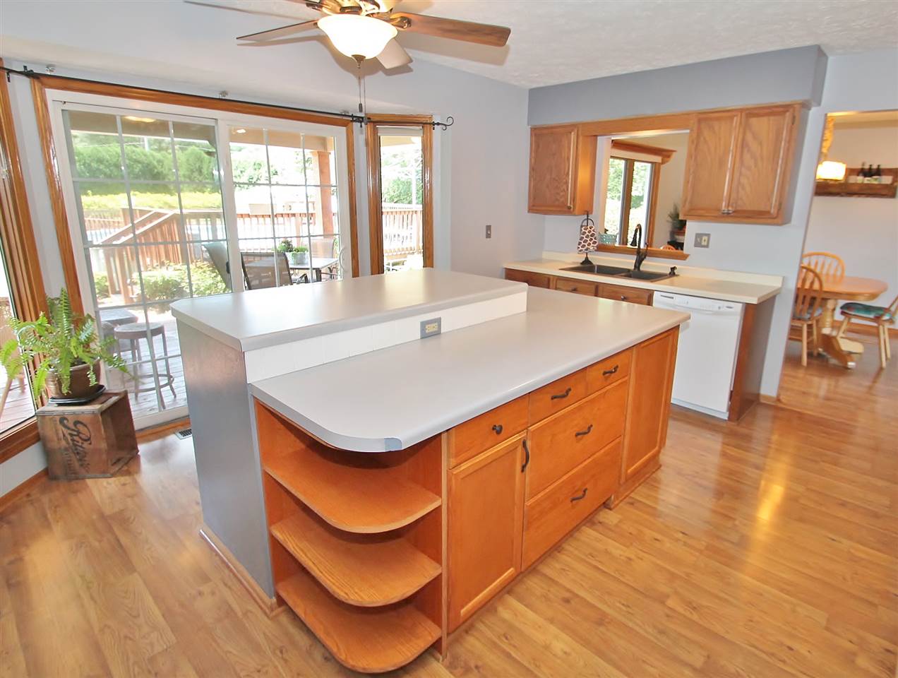 518 Pin Oak Road Rockton, IL 61072 - Photo 11 of 25 a kitchen with stainless steel appliances granite countertop a sink a stove and a dining table with wooden floor