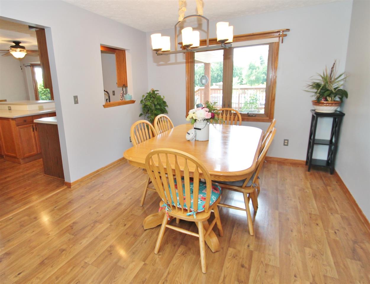 518 Pin Oak Road Rockton, IL 61072 - Photo 14 of 25 a view of a dining room with furniture window and wooden floor