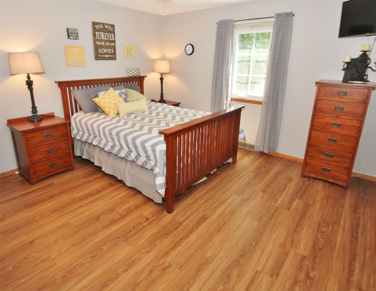 518 Pin Oak Road Rockton, IL 61072 - Photo 15 of 25 a bedroom with a bed and wooden floor