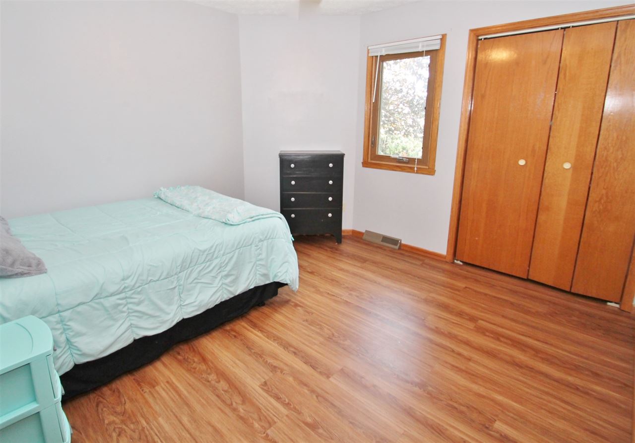 518 Pin Oak Road Rockton, IL 61072 - Photo 19 of 25 a bedroom with a bed and wooden floor