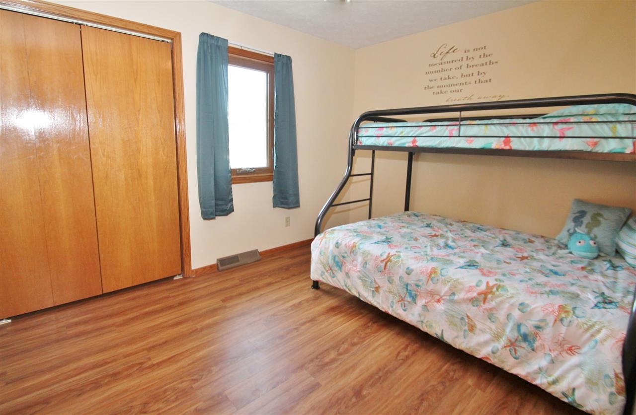 518 Pin Oak Road Rockton, IL 61072 - Photo 20 of 25 a bedroom with a bed and wooden floor