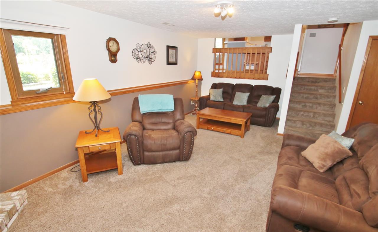 518 Pin Oak Road Rockton, IL 61072 - Photo 22 of 25 a living room with furniture and a window