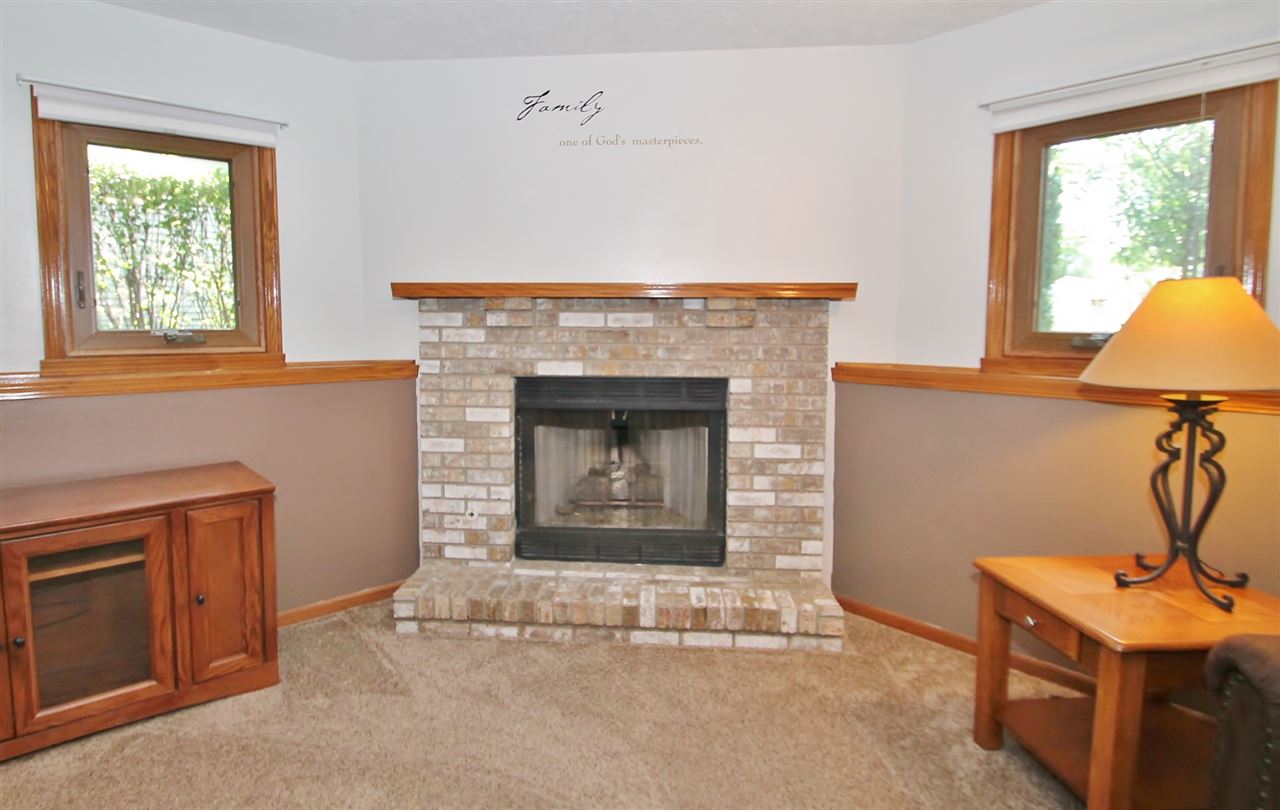 518 Pin Oak Road Rockton, IL 61072 - Photo 23 of 25 a living room with furniture and a fireplace