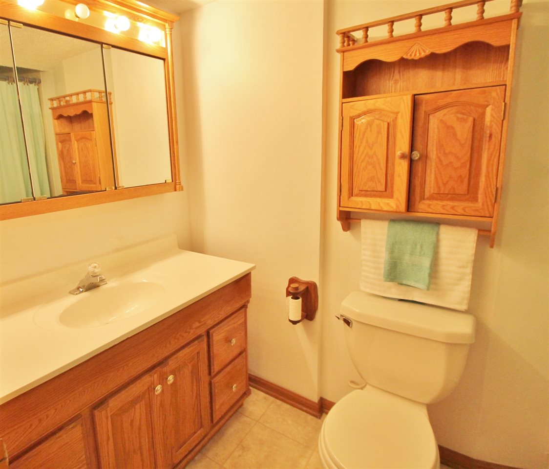 518 Pin Oak Road Rockton, IL 61072 - Photo 25 of 25 a bathroom with a granite countertop toilet sink and mirror