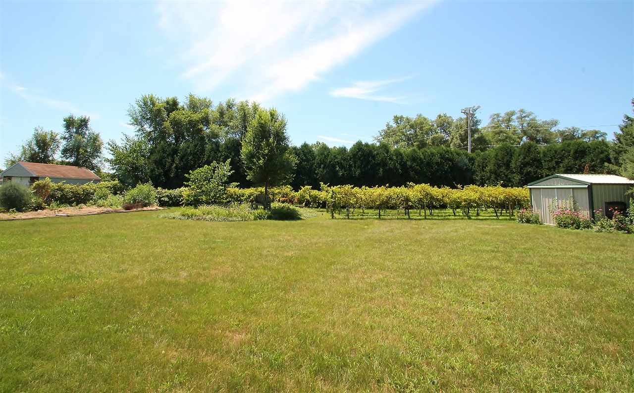 518 Pin Oak Road Rockton, IL 61072 - Photo 8 of 25 a view of a house with a yard and swimming pool