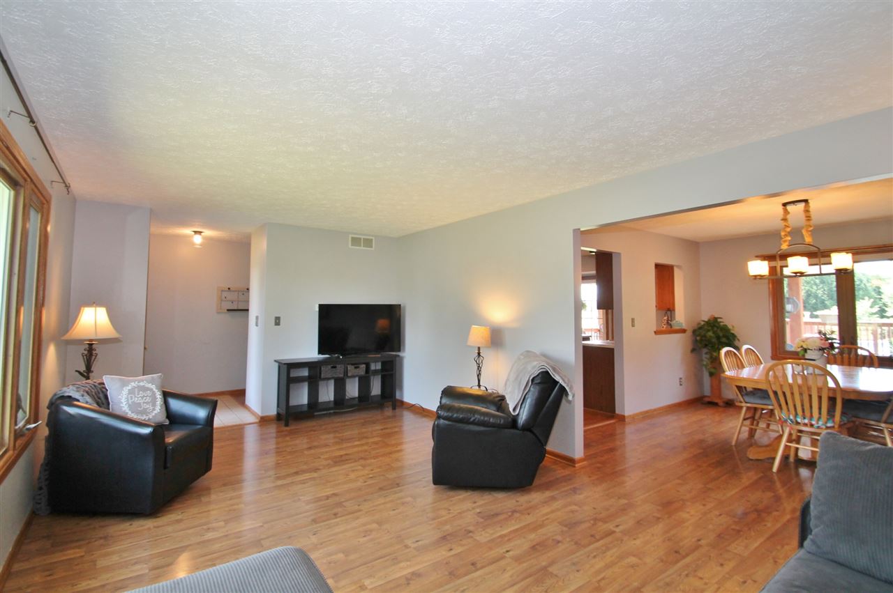518 Pin Oak Road Rockton, IL 61072 - Photo 10 of 25 a living room with furniture and a flat screen tv