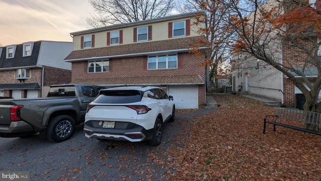 a car parked in front of a house