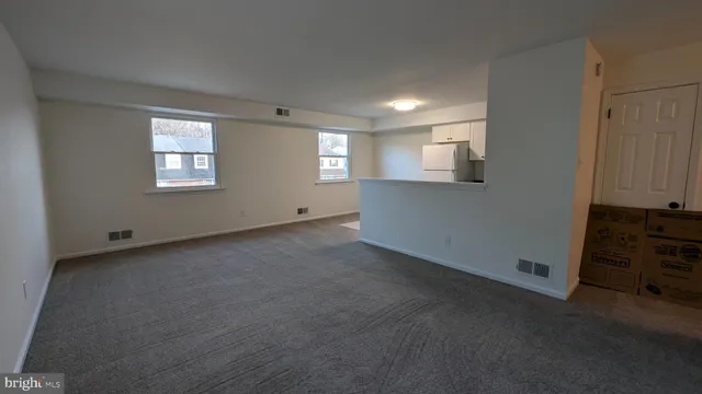 an empty room with windows