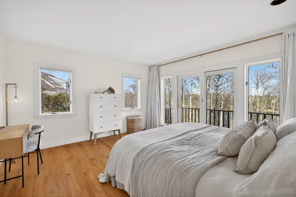 a bedroom with a bed and a lamp on table
