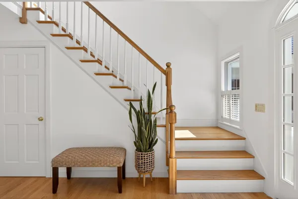 a living room with furniture a window and a table