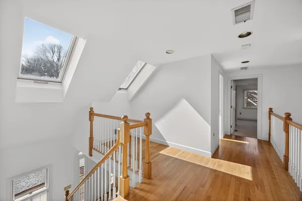 a bathroom with a double vanity sink mirror and shower