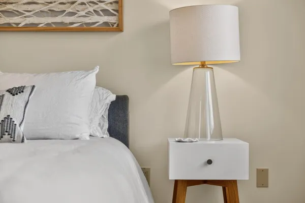 a living room with furniture and floor to ceiling windows