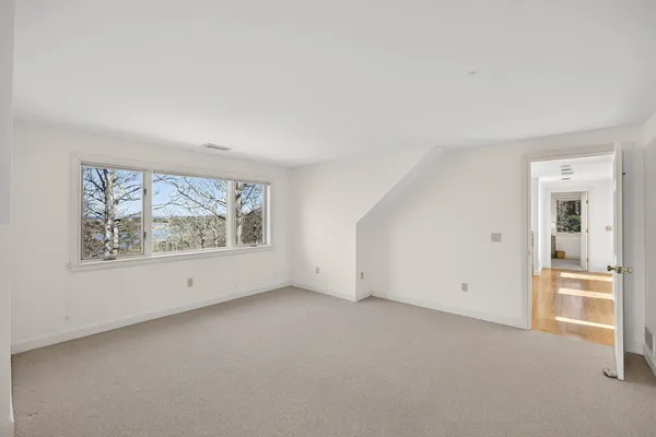 a view of workspace with wooden floor windows