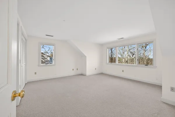 a view of a house that has a glass door and a window