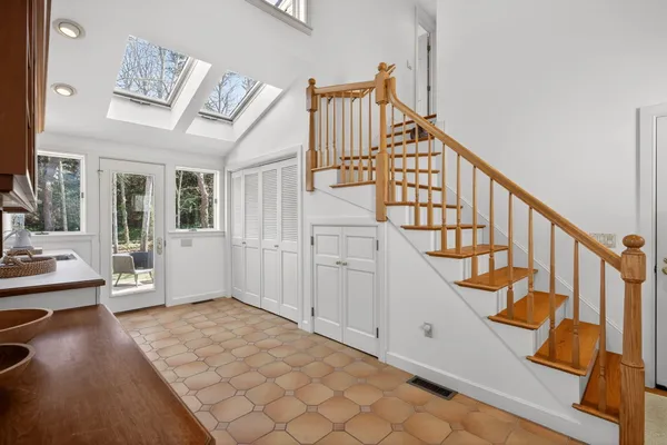 an aerial view of a house with a lake view