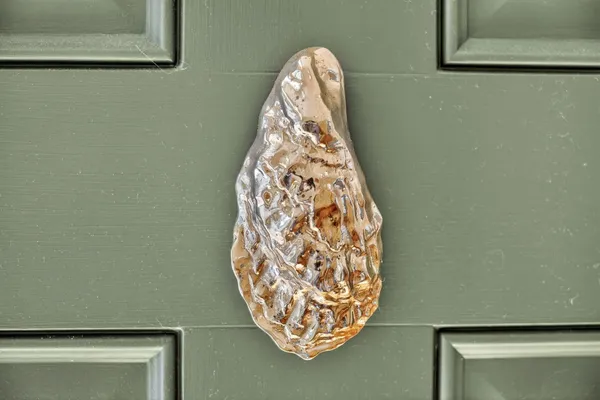 a living room with furniture and large windows