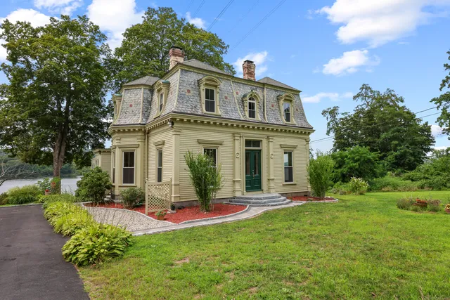 a front view of a house with a yard