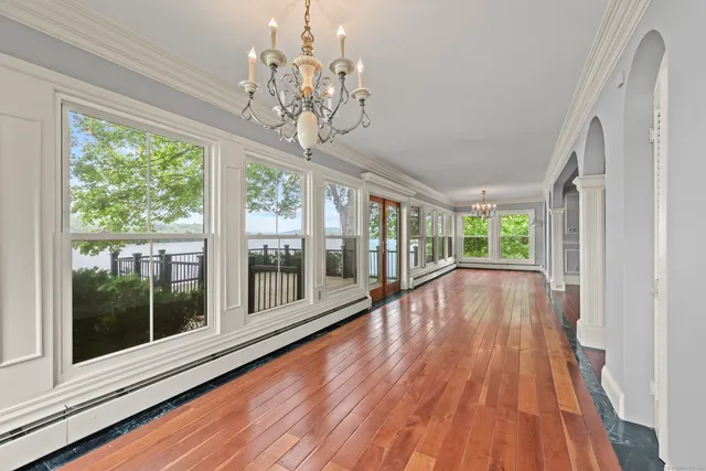 a view of a room with wooden floor and balcony