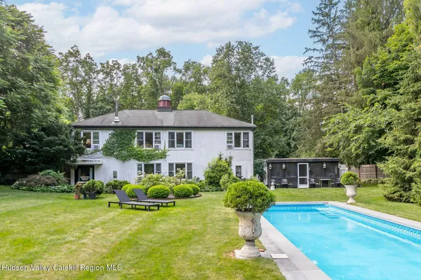 a front view of house with yard and green space