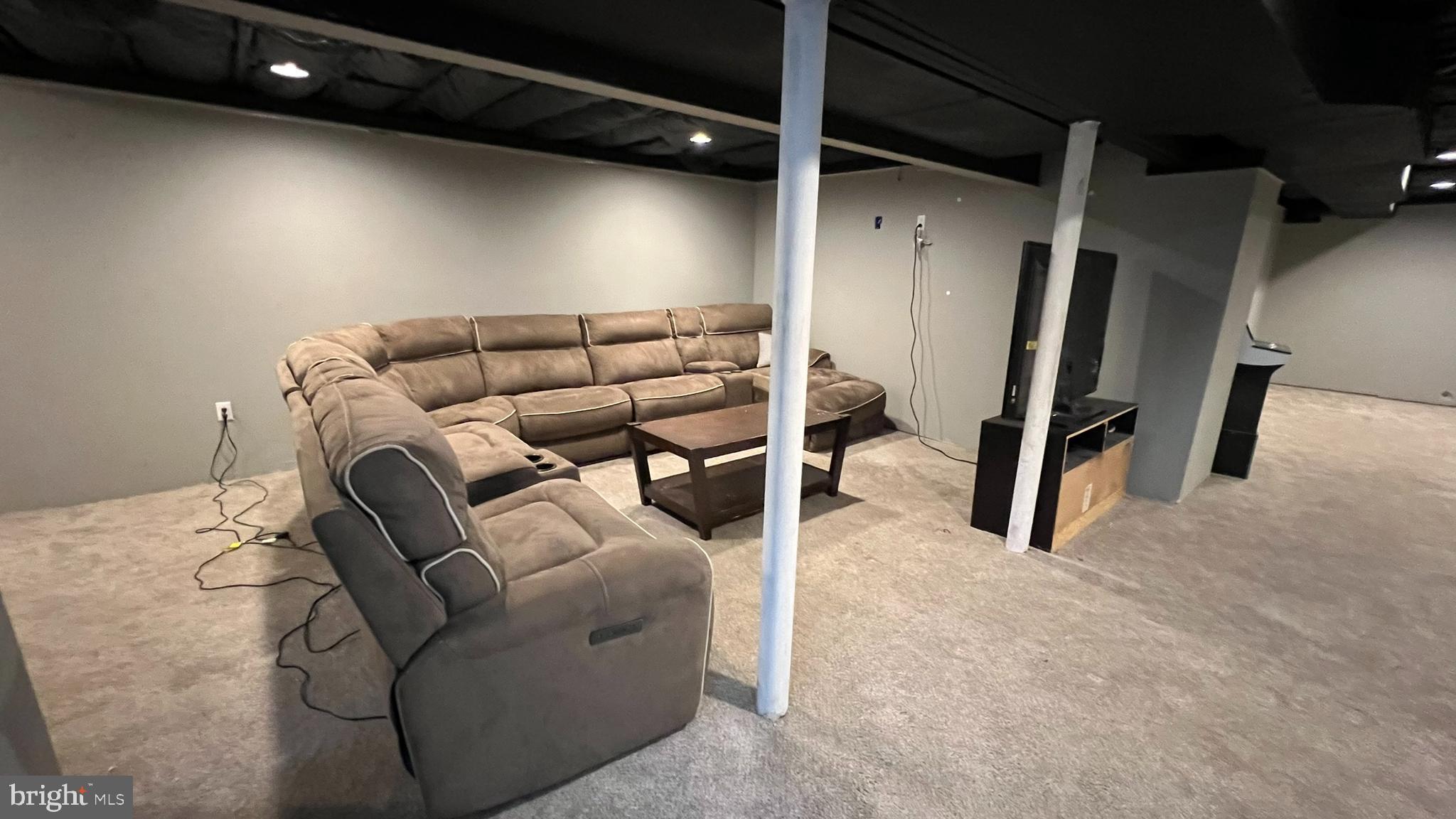 415 Stockton Loop Williamstown, NJ 08094 - Photo 23 of 41 a living room with furniture and a flat screen tv