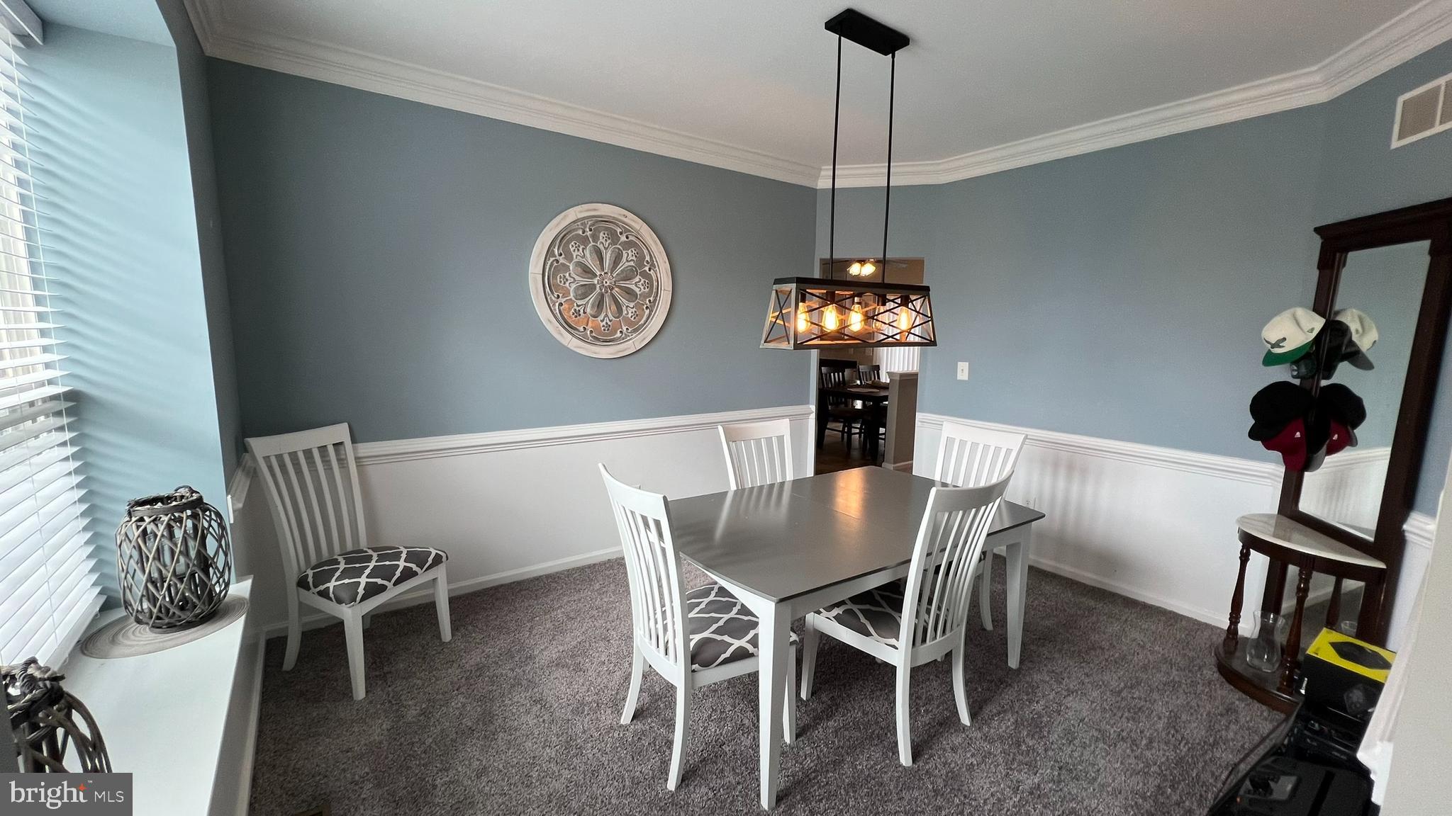 415 Stockton Loop Williamstown, NJ 08094 - Photo 5 of 41 a view of a dining room with furniture chandelier and a window