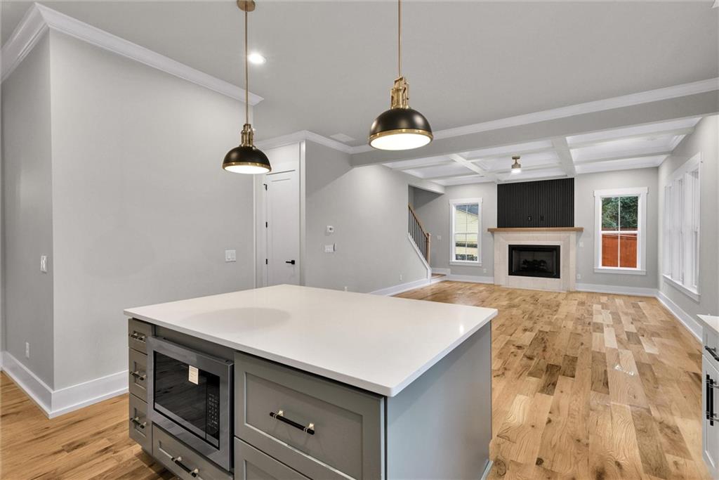 3369 Dodson Drive Connector East Point, GA 30344 - Photo 12 of 43 a kitchen with a stove and a wooden floor