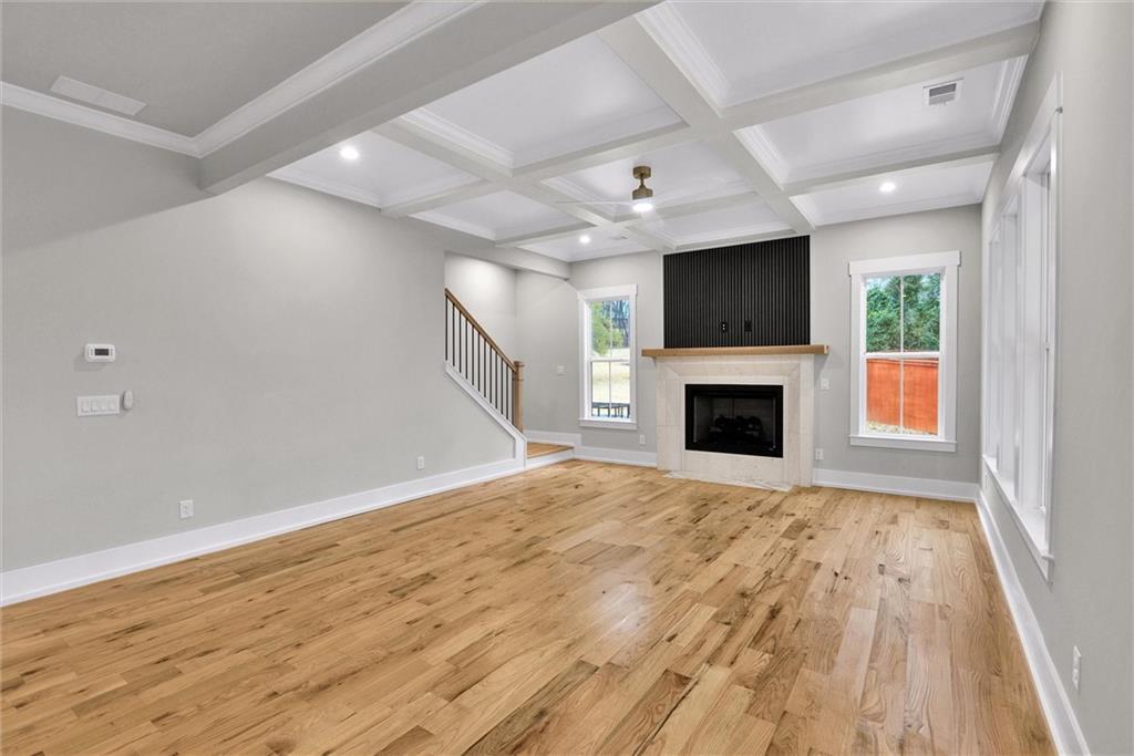 3369 Dodson Drive Connector East Point, GA 30344 - Photo 16 of 43 a view of empty room with wooden floor and fireplace