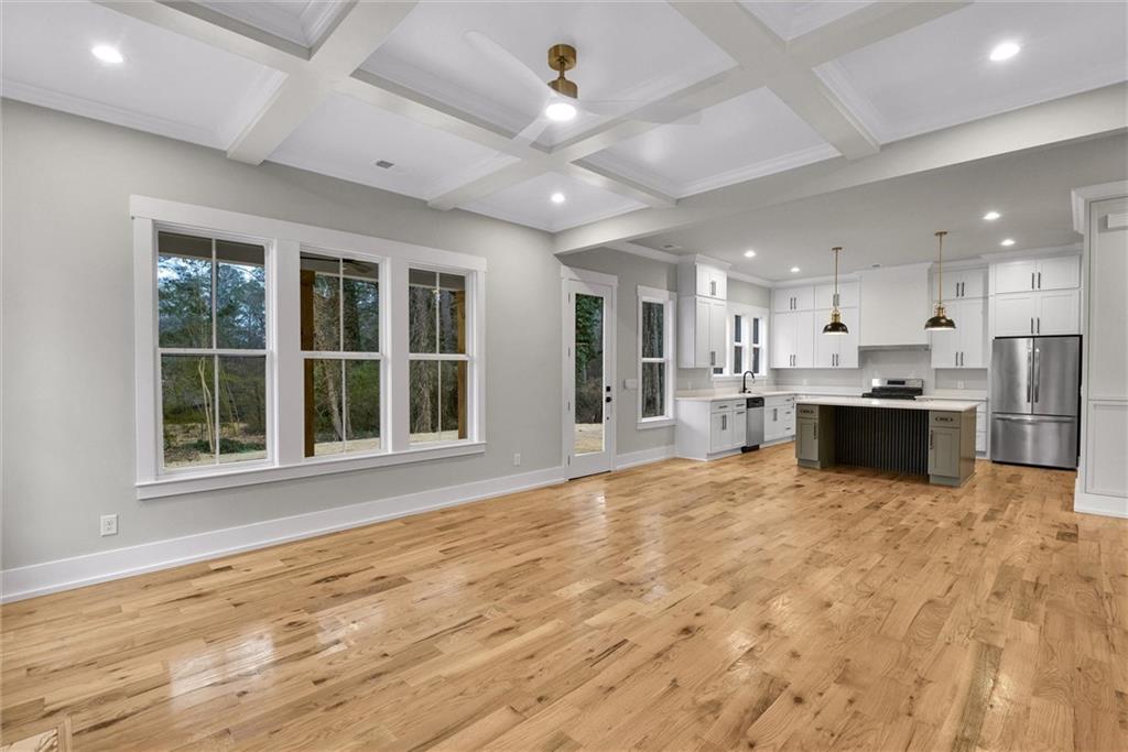3369 Dodson Drive Connector East Point, GA 30344 - Photo 19 of 43 a view of an empty room with kitchen and window