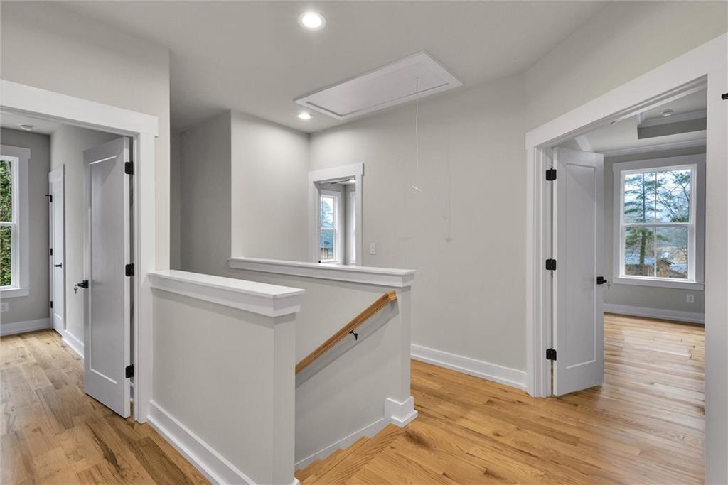 3369 Dodson Drive Connector East Point, GA 30344 - Photo 21 of 43 a hallway view with wooden floor and staircase