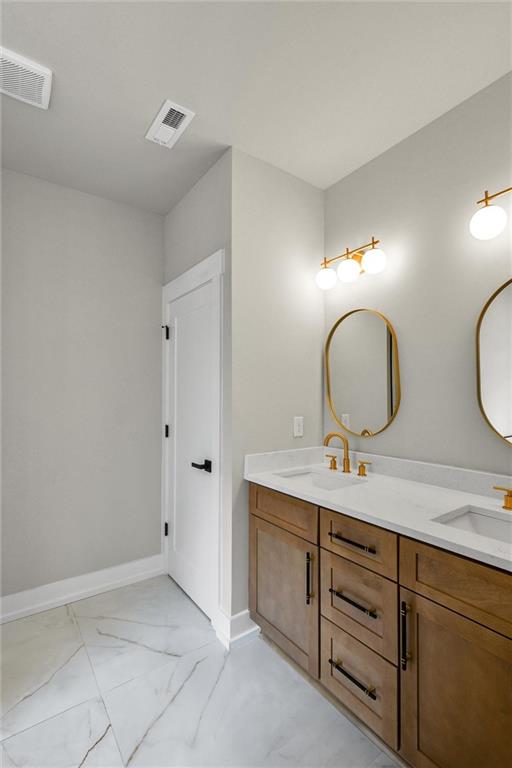 3369 Dodson Drive Connector East Point, GA 30344 - Photo 26 of 43 a bathroom with a double vanity sink and a mirror