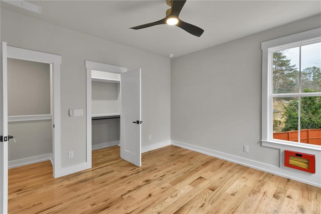 3369 Dodson Drive Connector East Point, GA 30344 - Photo 30 of 43 an empty room with wooden floor cabinet and windows