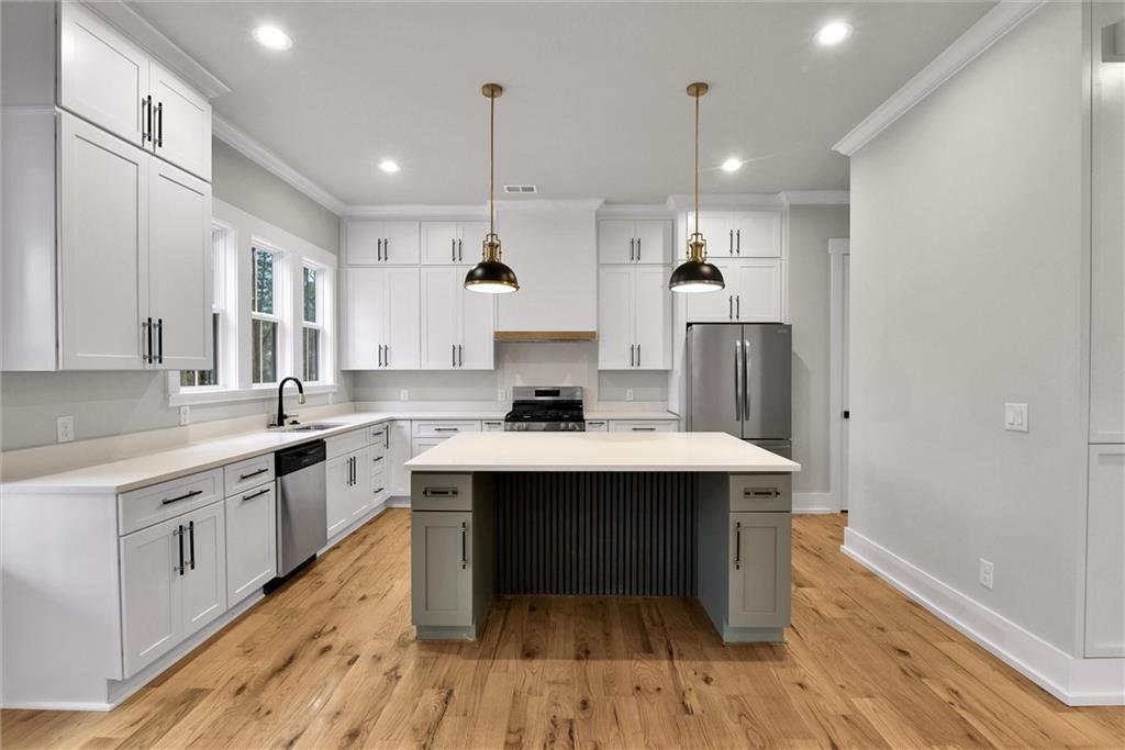 3369 Dodson Drive Connector East Point, GA 30344 - Photo 10 of 43 a large kitchen with a sink and cabinets