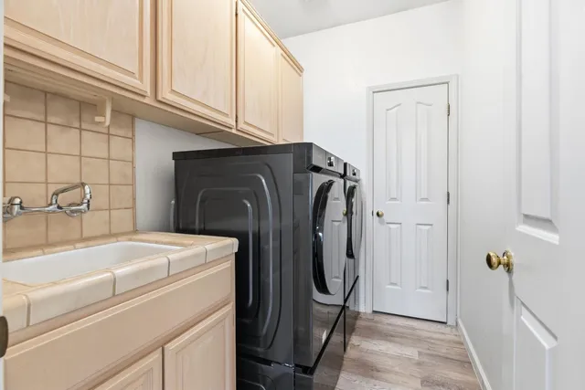 a utility room with dryer and washer
