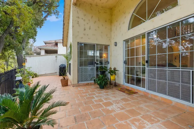 a view of a entryway with flower plants