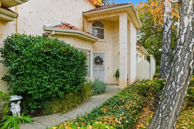 front view of a house with a small yard