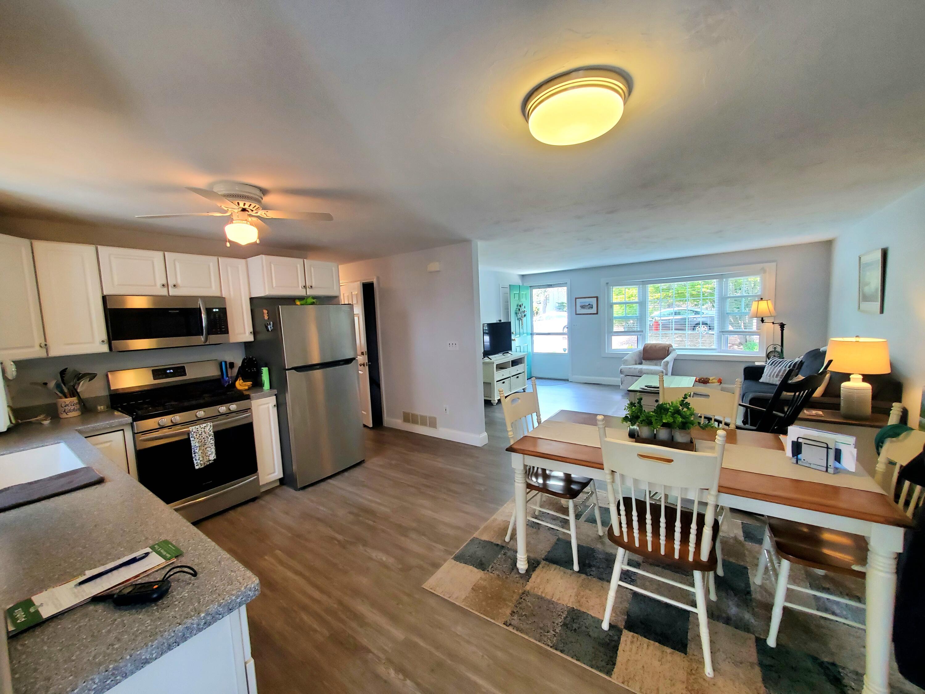 52 Thayer Road Dennis, MA 02660 - Photo 7 of 19 a view of a dining room with furniture window and wooden floor