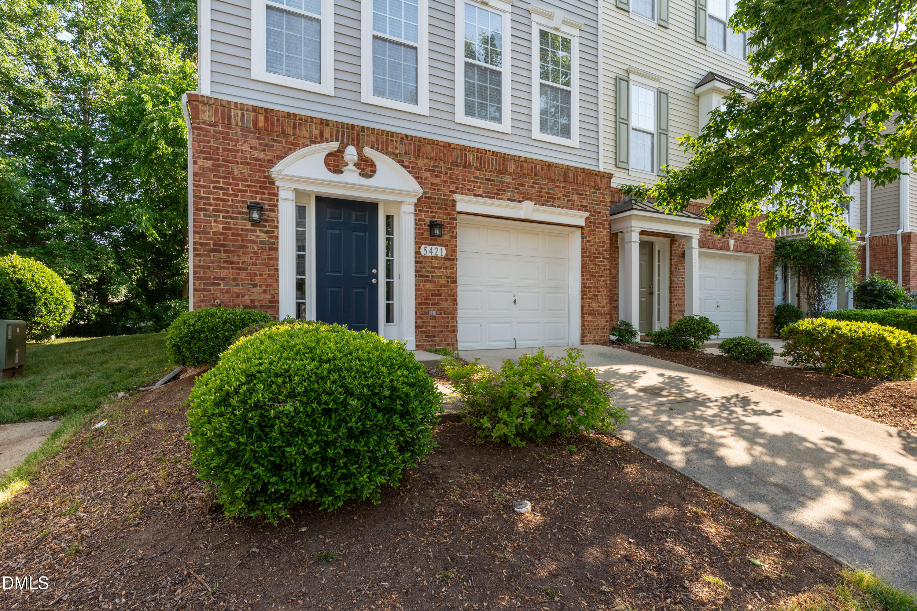 5421 Golden Arrow Lane Raleigh, NC 27613 - Photo 4 of 49 a front view of a house with garden