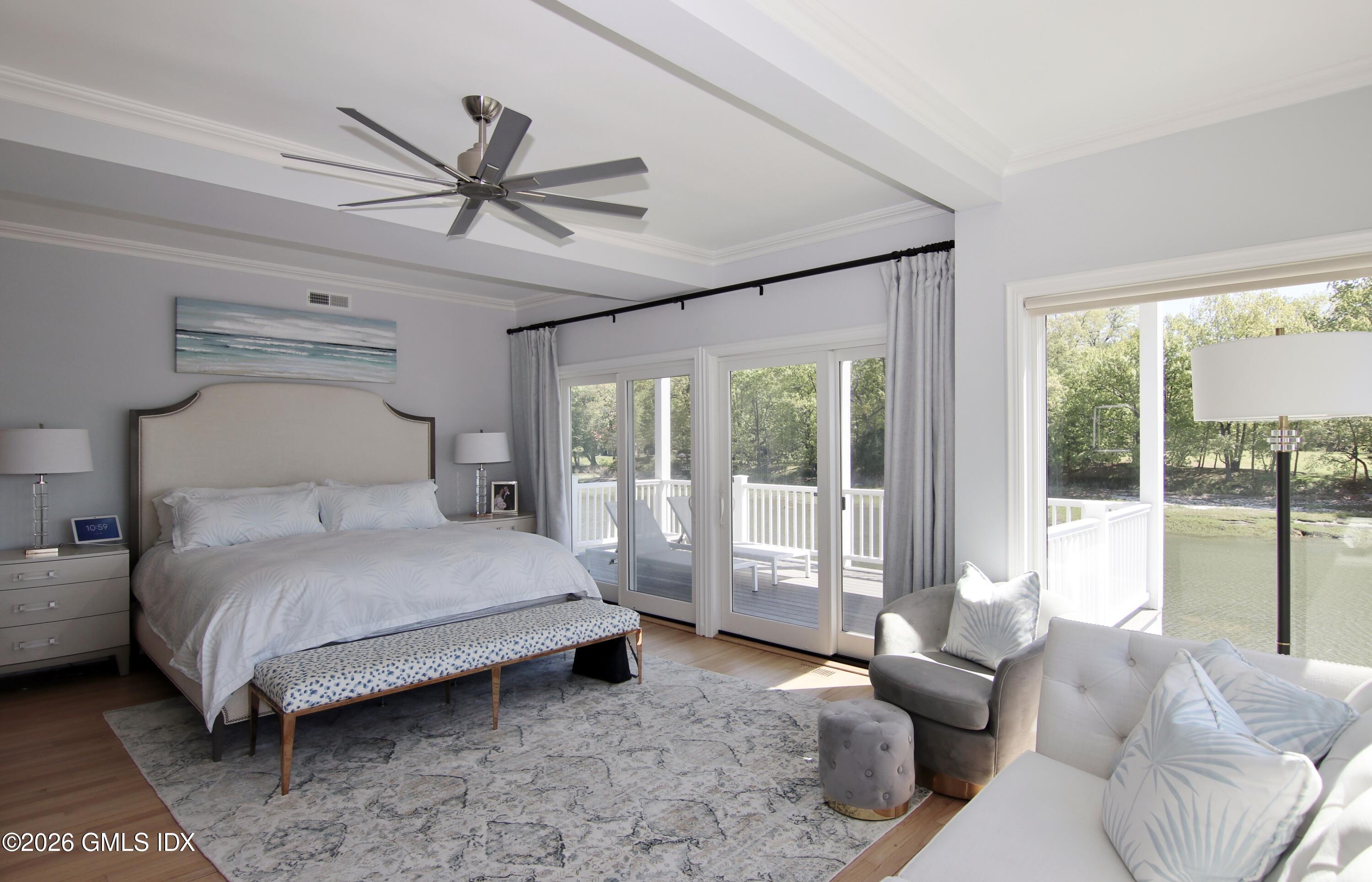 633 Steamboat Road, Unit 5 Greenwich, CT 06830 - Photo 11 of 29 a bedroom with a bed and a large window