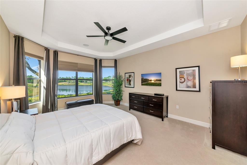 12848 Del Corso Loop Lakewood Ranch, FL 34211 - Photo 19 of 70 a bedroom with a bed and wooden floor