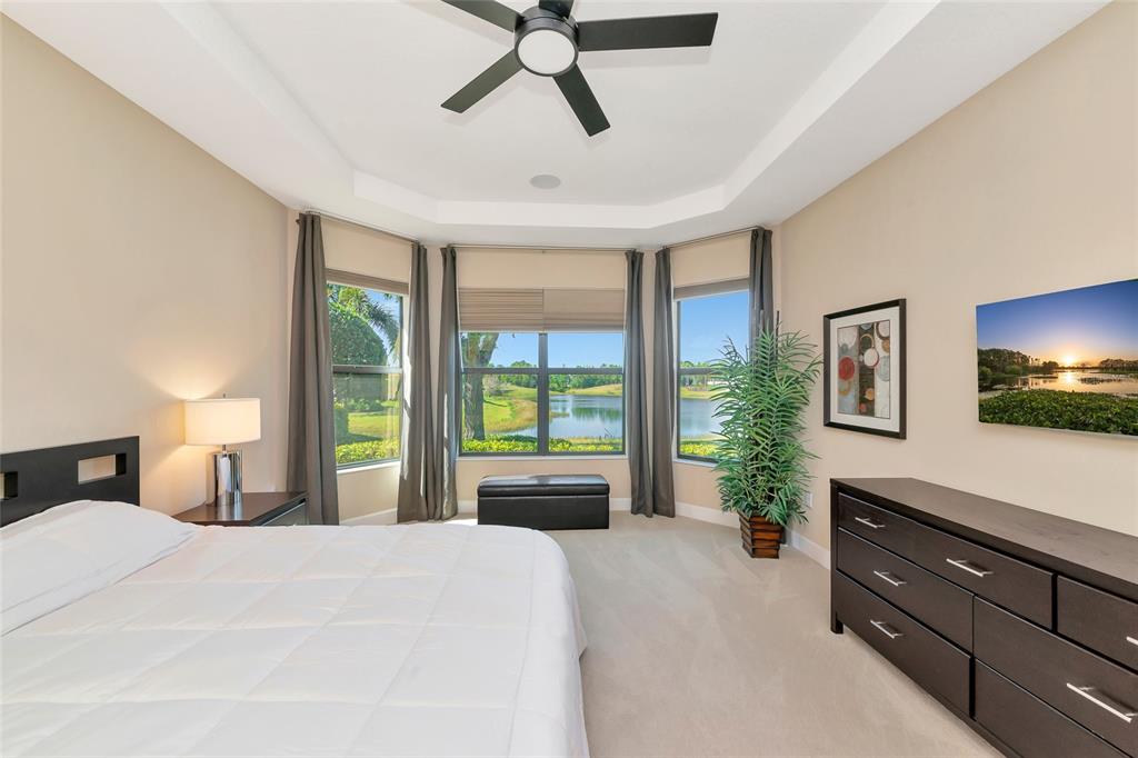 12848 Del Corso Loop Lakewood Ranch, FL 34211 - Photo 20 of 70 a bedroom with a bed and a large window