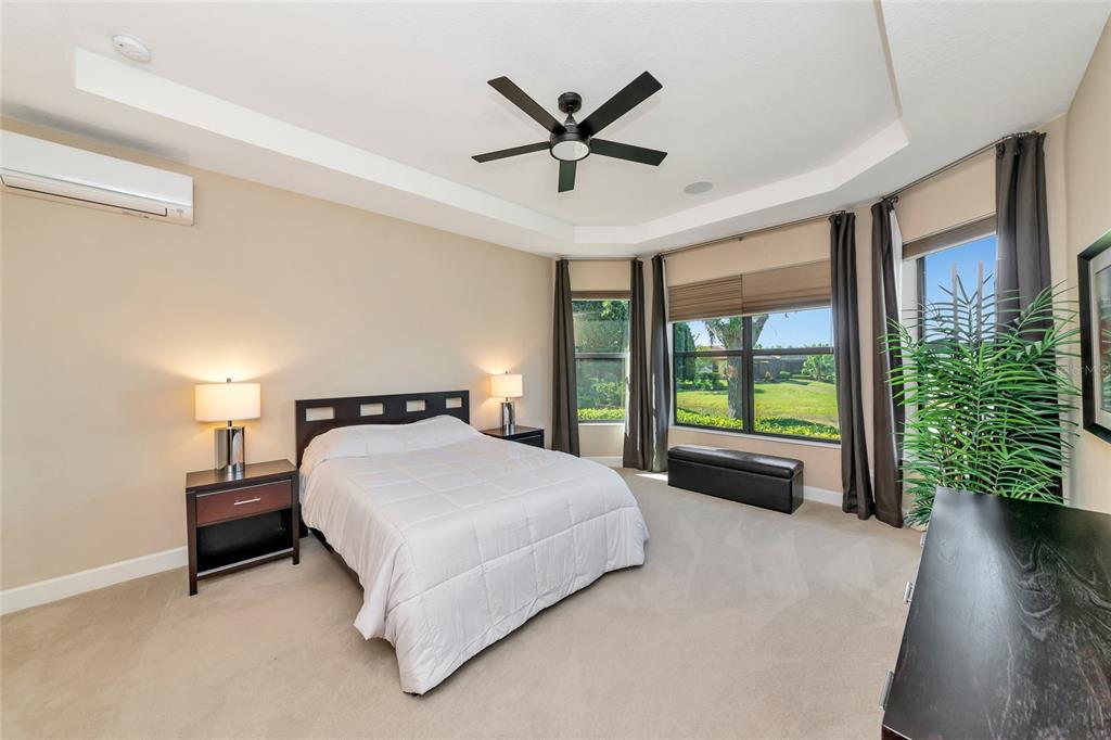 12848 Del Corso Loop Lakewood Ranch, FL 34211 - Photo 22 of 70 a bedroom with a bed and window