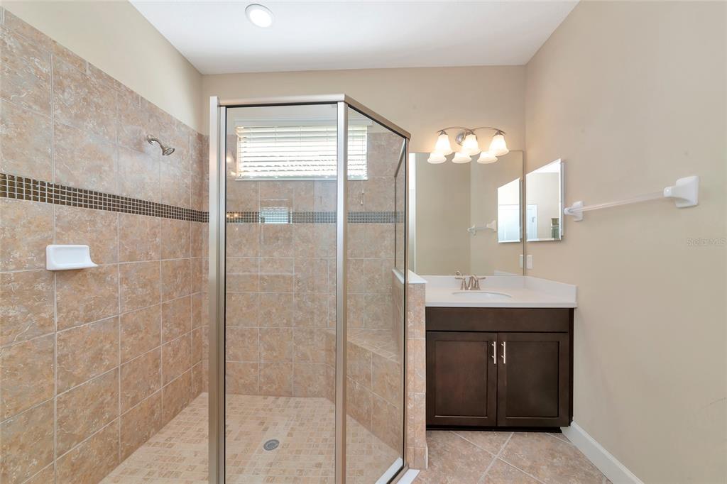 12848 Del Corso Loop Lakewood Ranch, FL 34211 - Photo 27 of 70 a bathroom with a double vanity sink mirror and shower