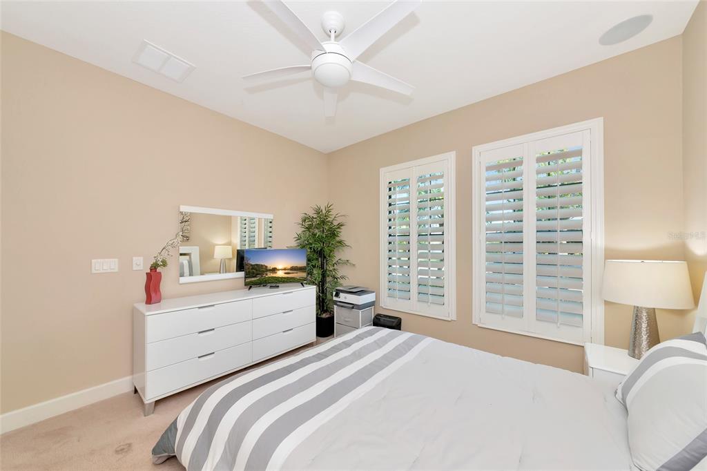 12848 Del Corso Loop Lakewood Ranch, FL 34211 - Photo 30 of 70 a bedroom with a bed and a large window