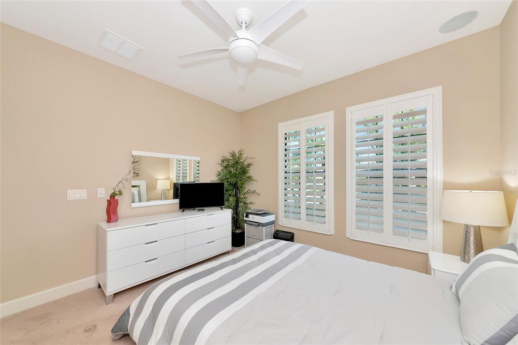 12848 Del Corso Loop Lakewood Ranch, FL 34211 - Photo 31 of 70 a bedroom with a large bed and a large window