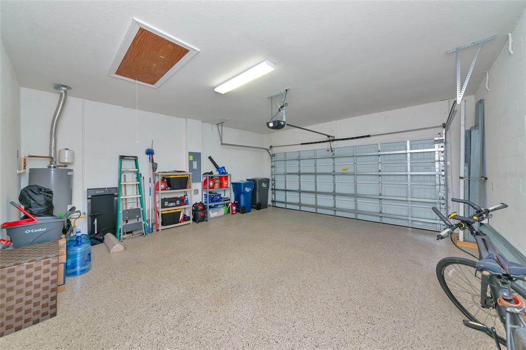 12848 Del Corso Loop Lakewood Ranch, FL 34211 - Photo 38 of 70 a view of a garage with rack and bicycle