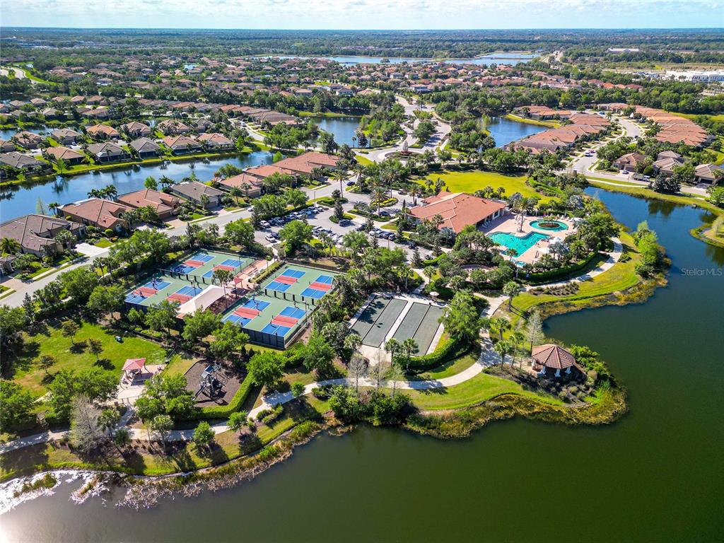 12848 Del Corso Loop Lakewood Ranch, FL 34211 - Photo 52 of 70 an aerial view of residential houses with outdoor space and swimming pool